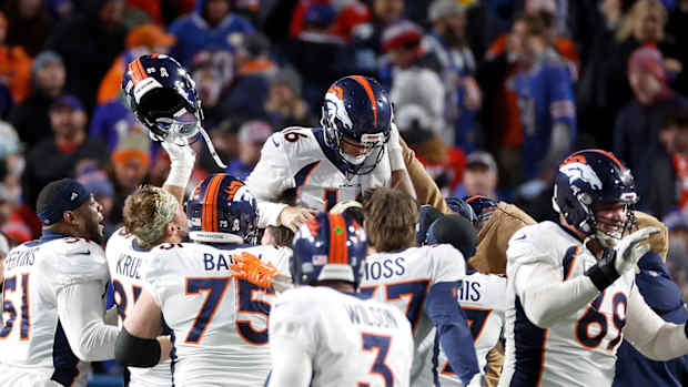Denver Broncos place kicker Wil Lutz (16) is hoisted on his teammates shoulders after kicking the game winning field goal for a 24-22 win over the Bills.  